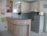 The kitchen area, with electric hotplates, microwave, fridge.